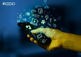 A hand holds a smartphone in a dark setting, with glowing digital icons like a Wi-Fi symbol and email emerging from the screen, conveying connectivity.